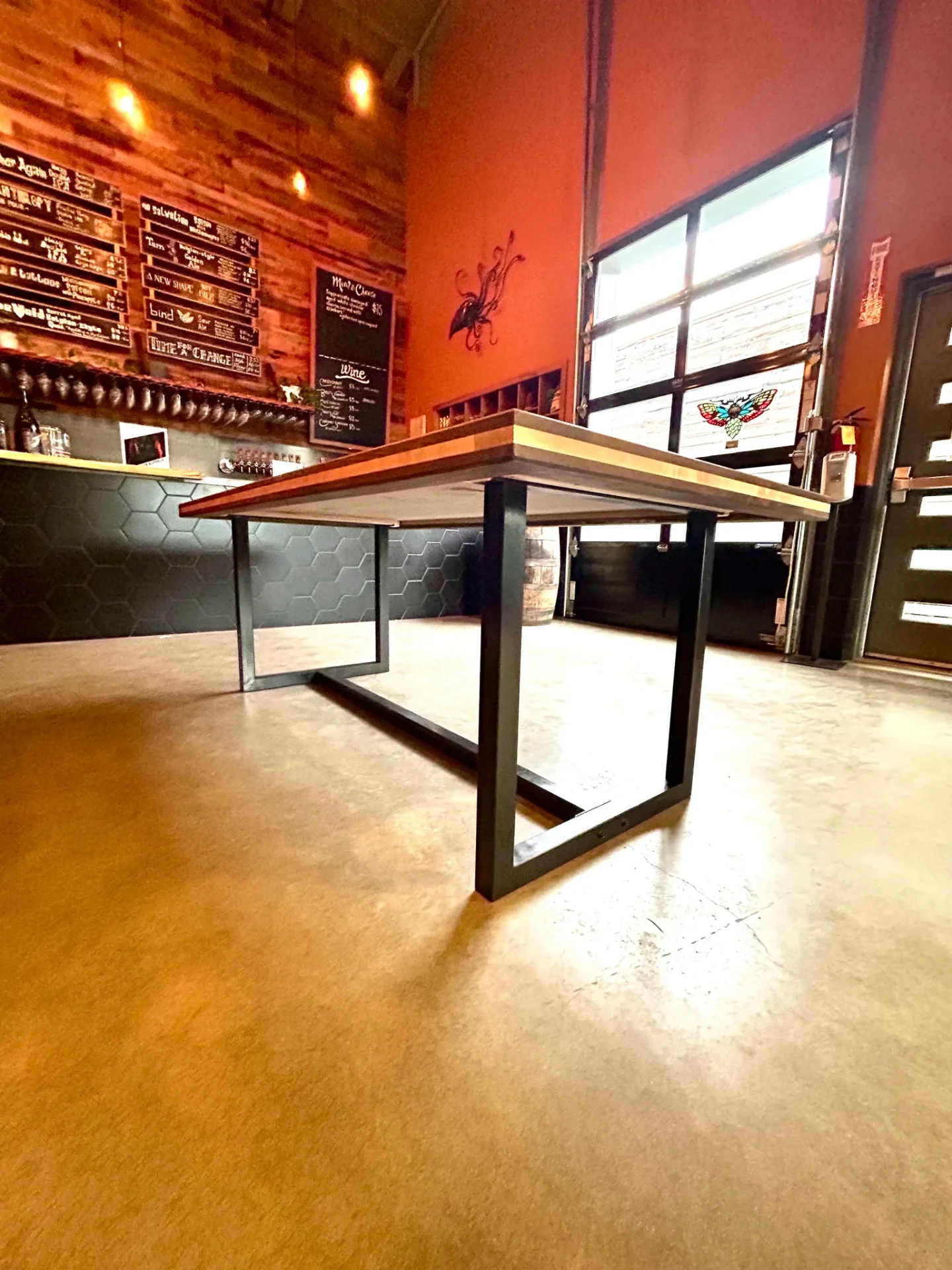 Marie's black walnut table with maple accents in brewery taproom setting